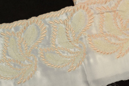 Embroidered lace on sateen