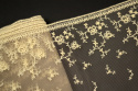 Embroidered lace in beige color